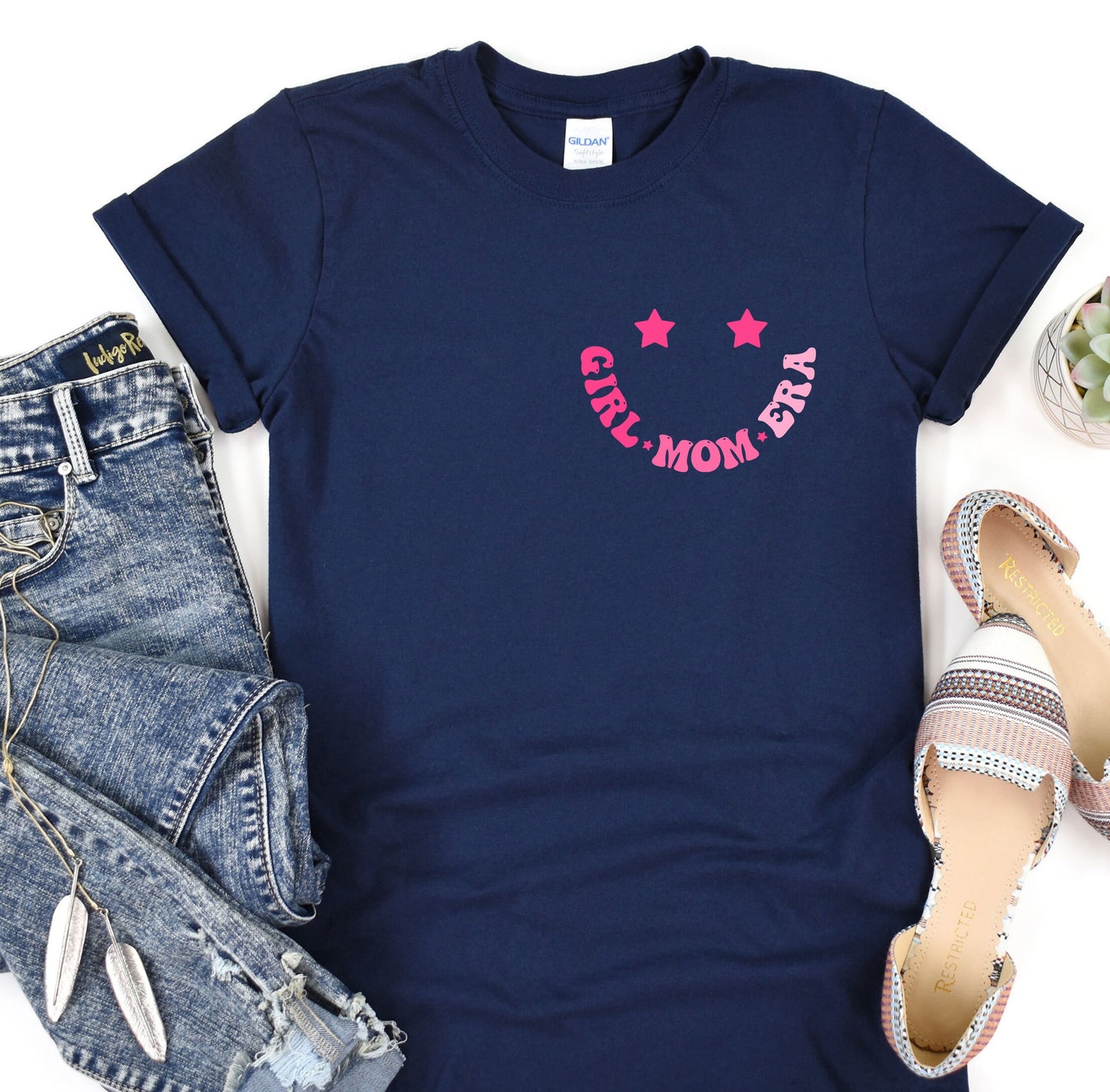a women's t - shirt with a pink star on it