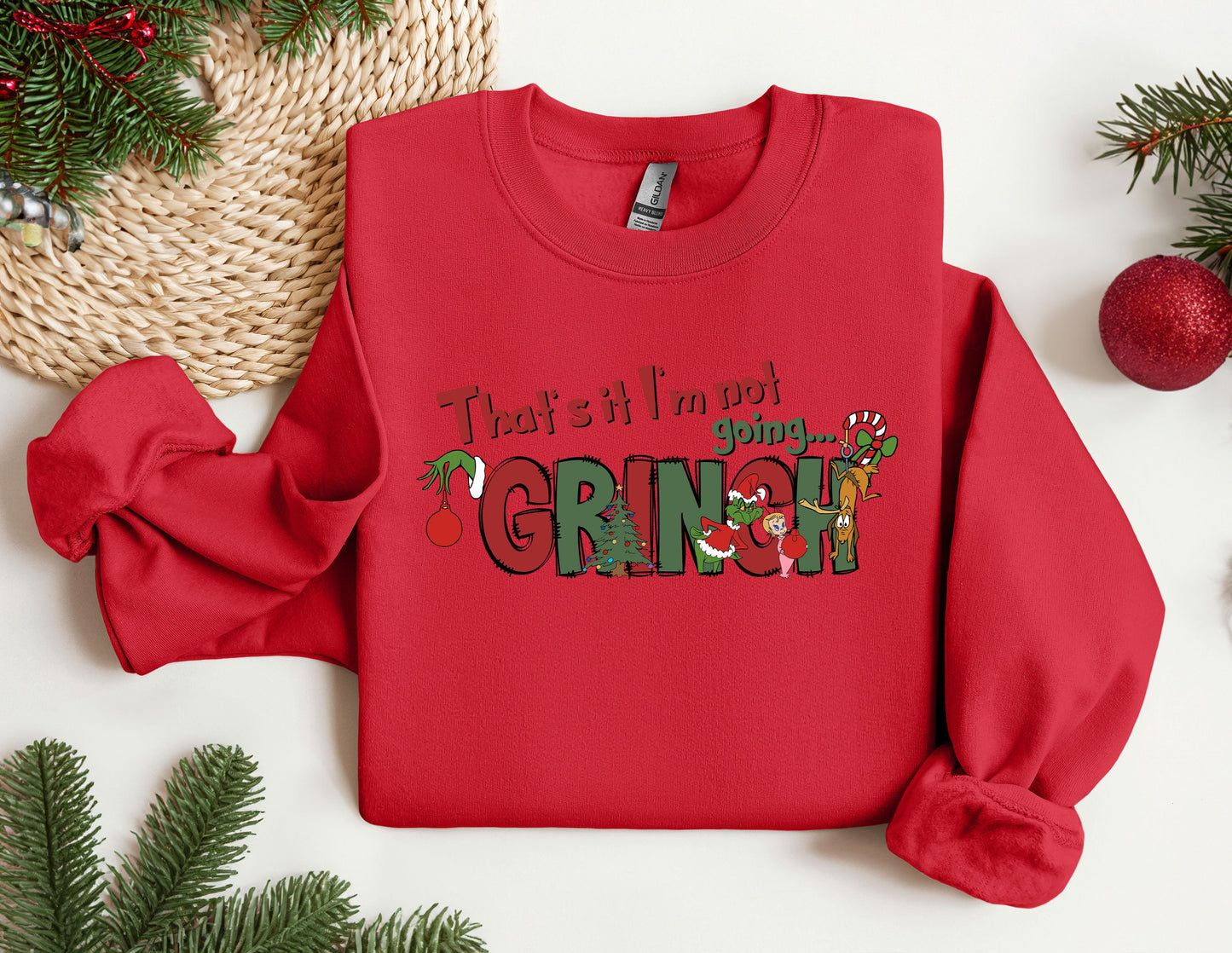 a red sweatshirt with the words, that's it's not grinin