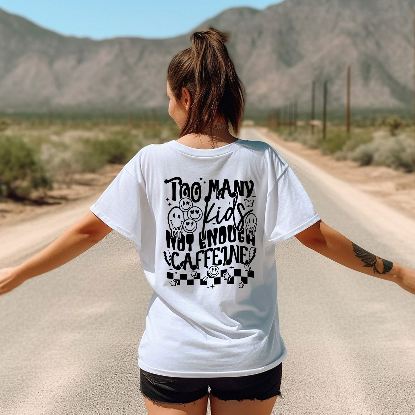 a woman walking down a road with her arms outstretched