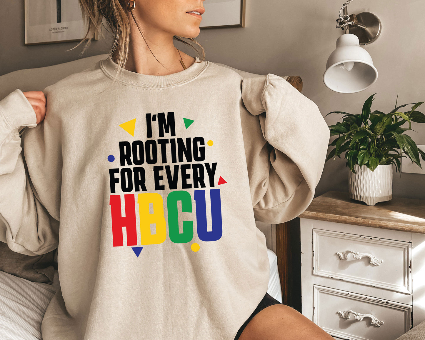 a woman wearing a sweatshirt that says i'm rooting for every hbc