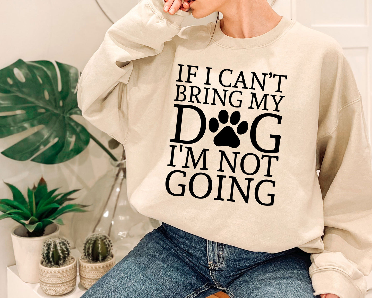 a woman wearing a sweatshirt that says, if i can't bring my dog