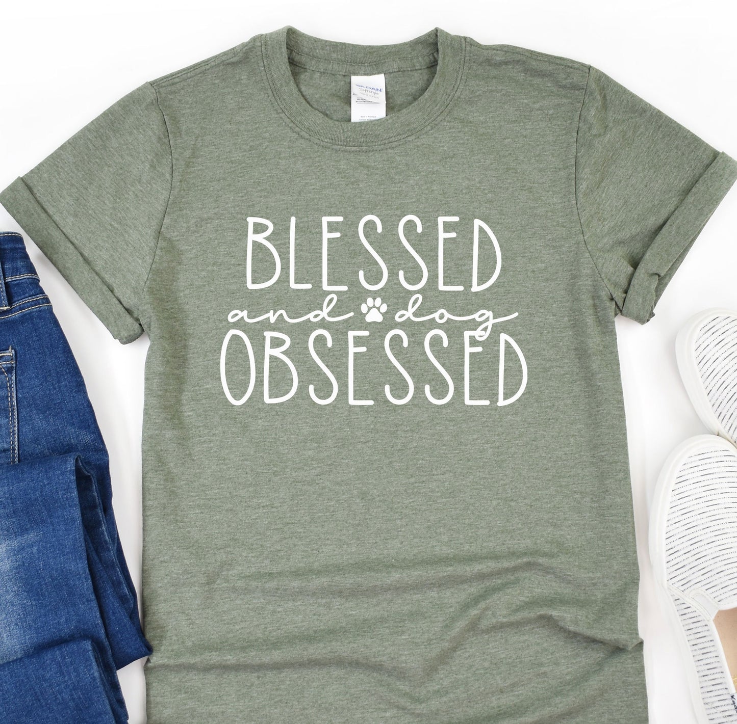 a t - shirt that says, blessed and a pair of jeans
