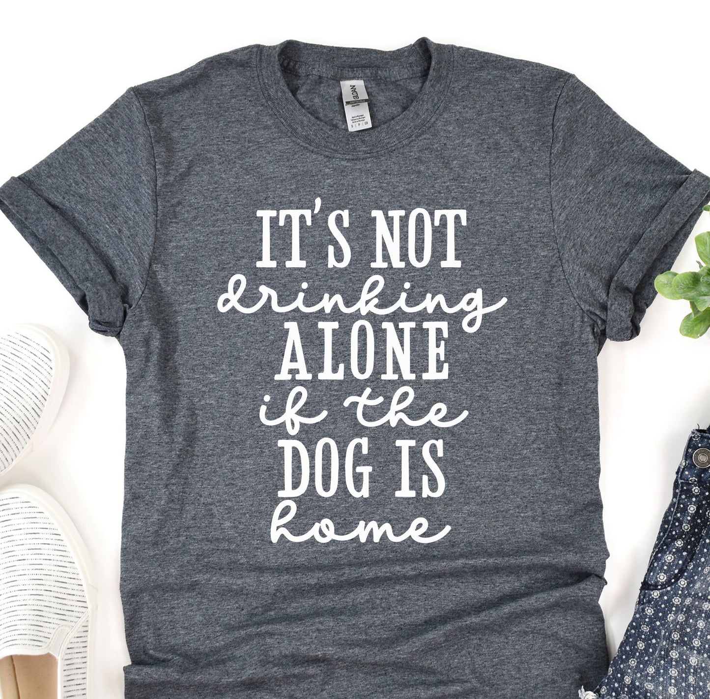 a t - shirt that says it's not drinking alone of the dog is