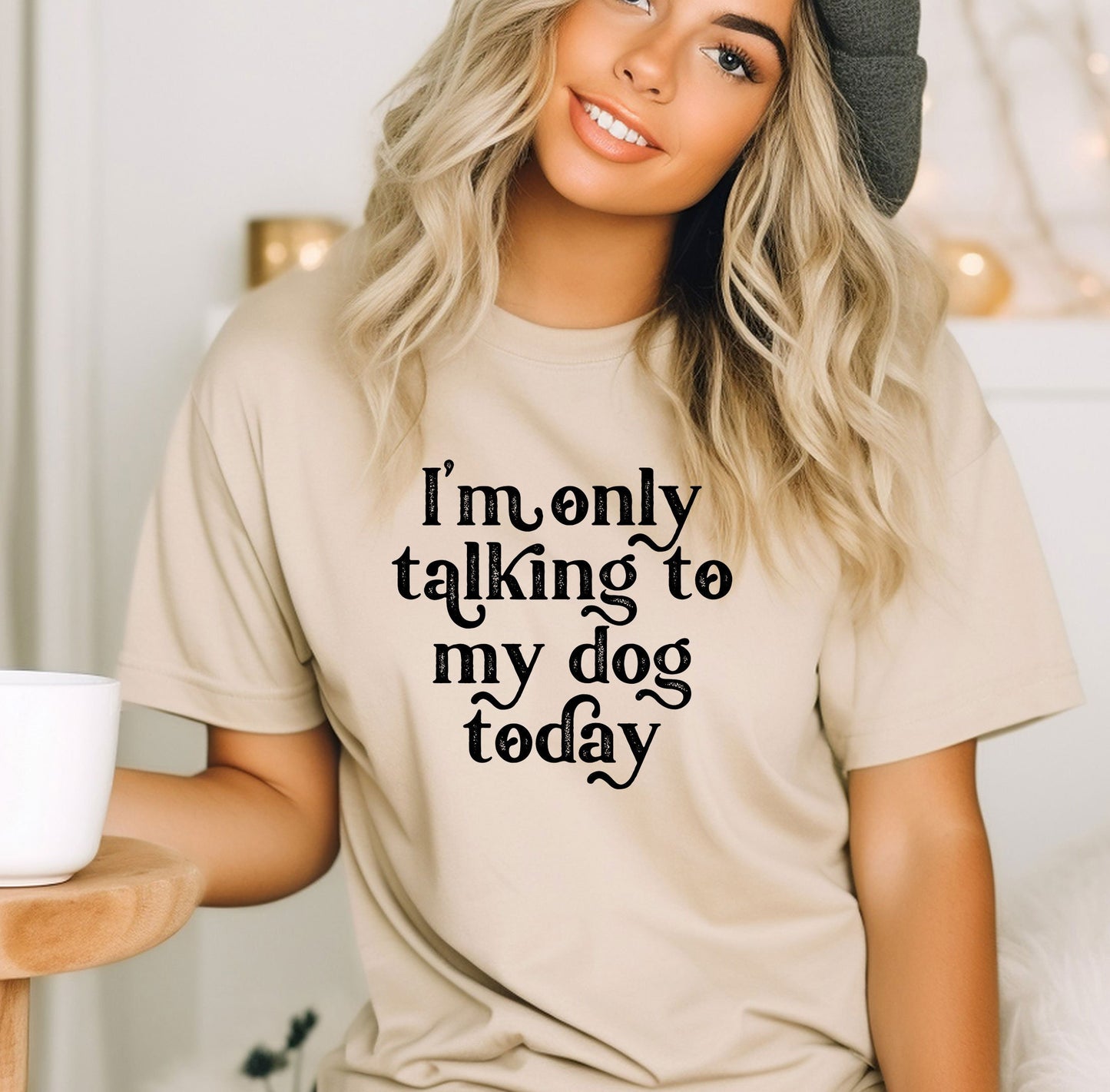 a woman wearing a t - shirt that says i'm only talking to my