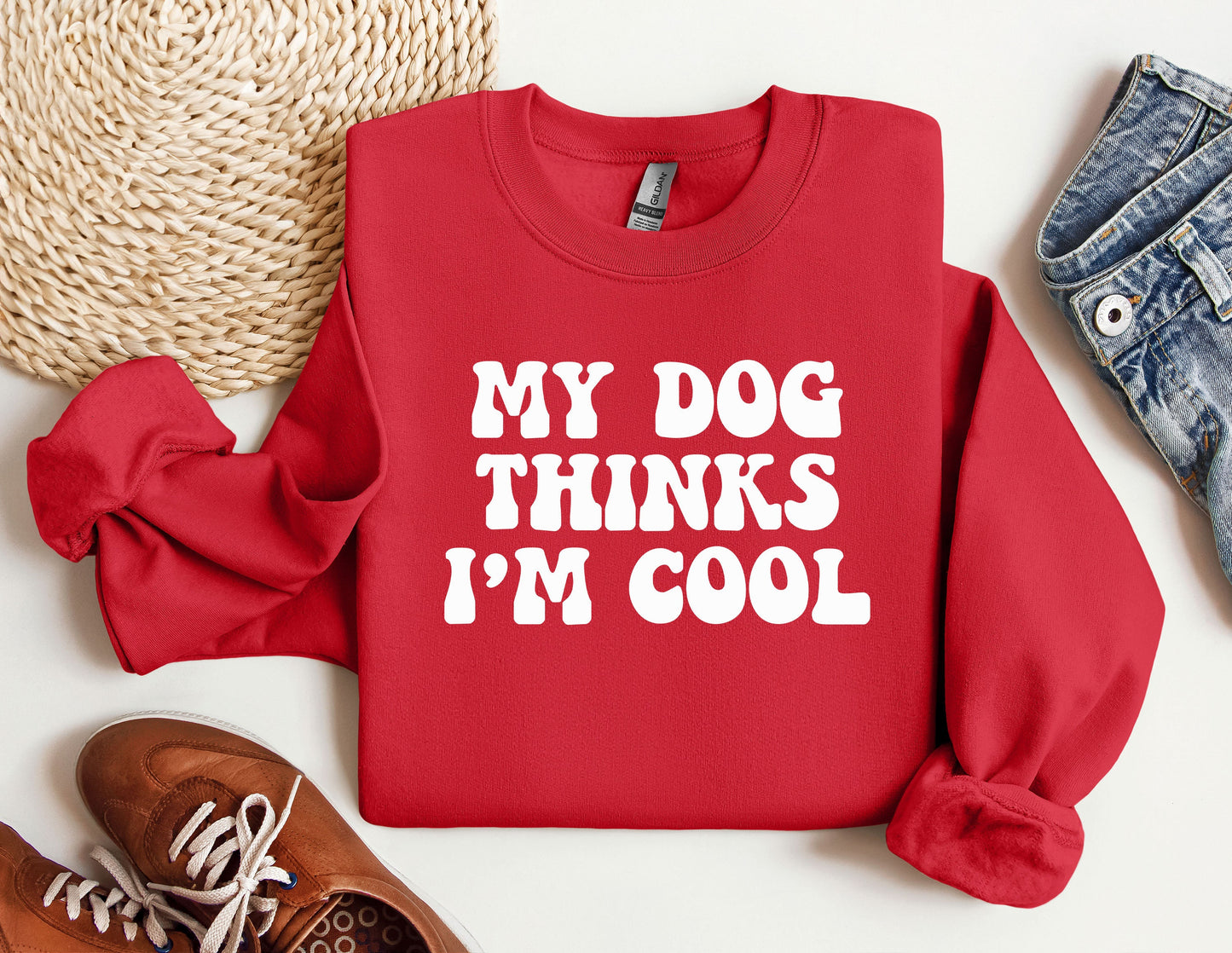 a red sweatshirt that says, my dog thinks i'm cool