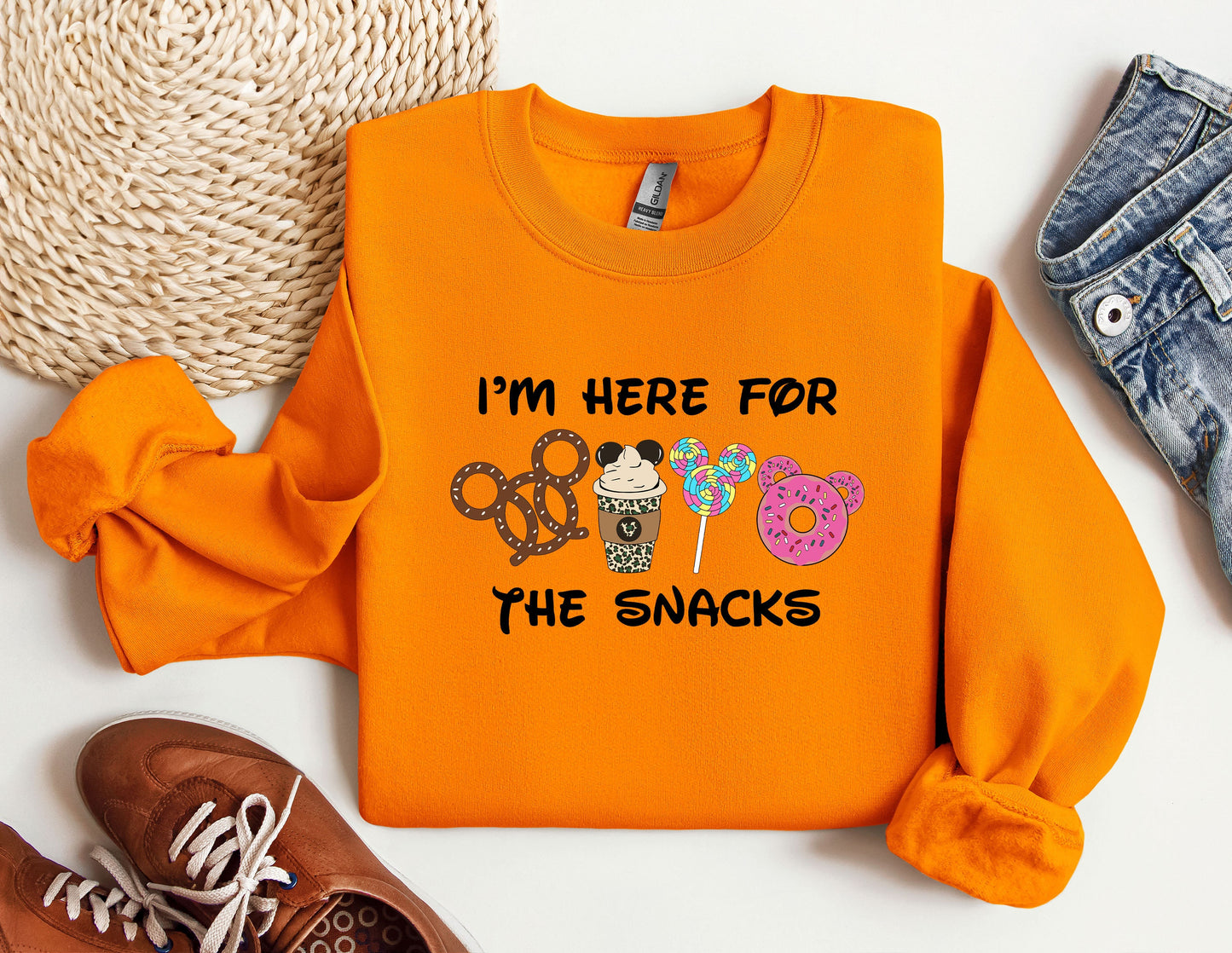 a pair of shoes and an orange shirt with the words i'm here for