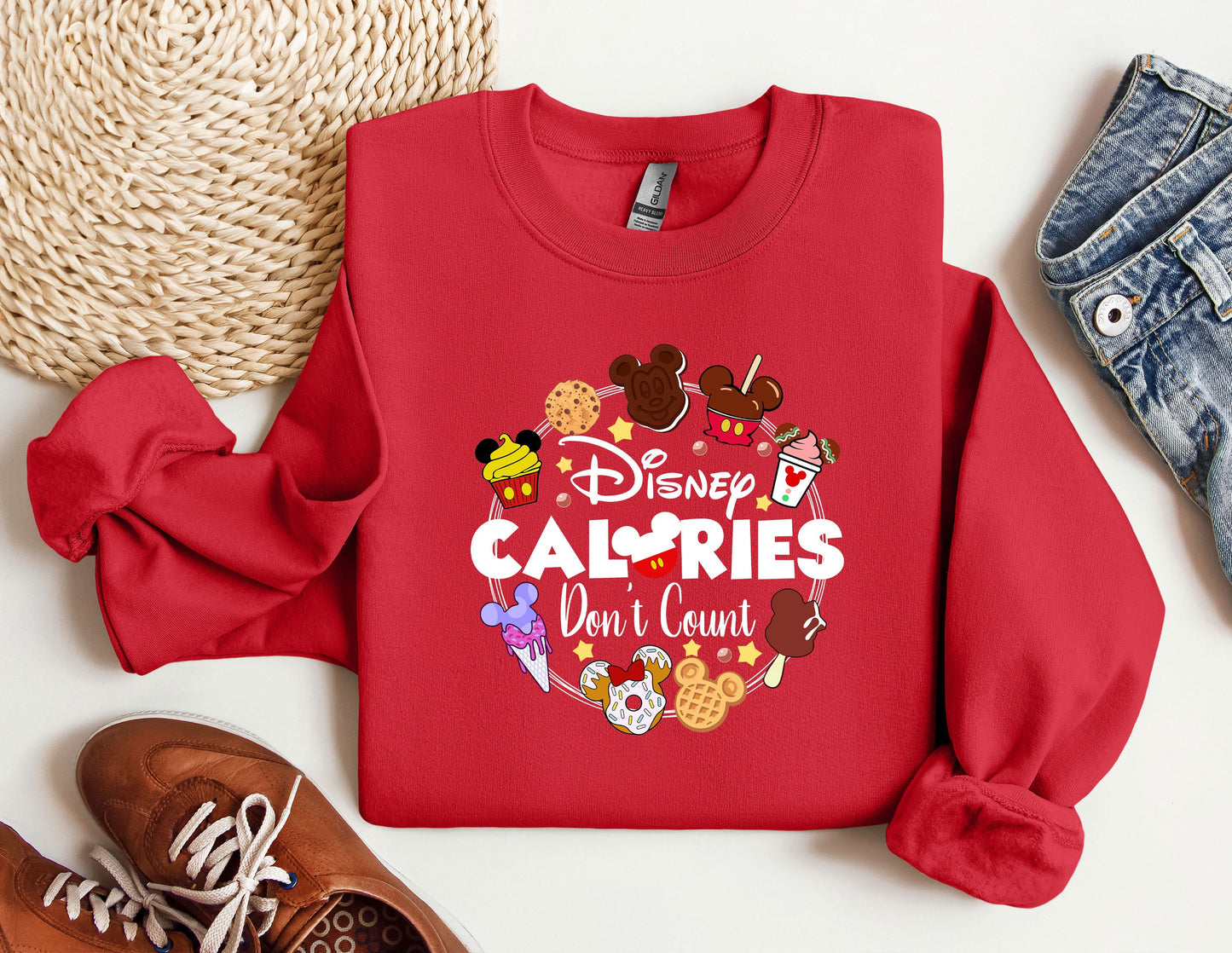a red sweatshirt with the words disney calories don't count on it
