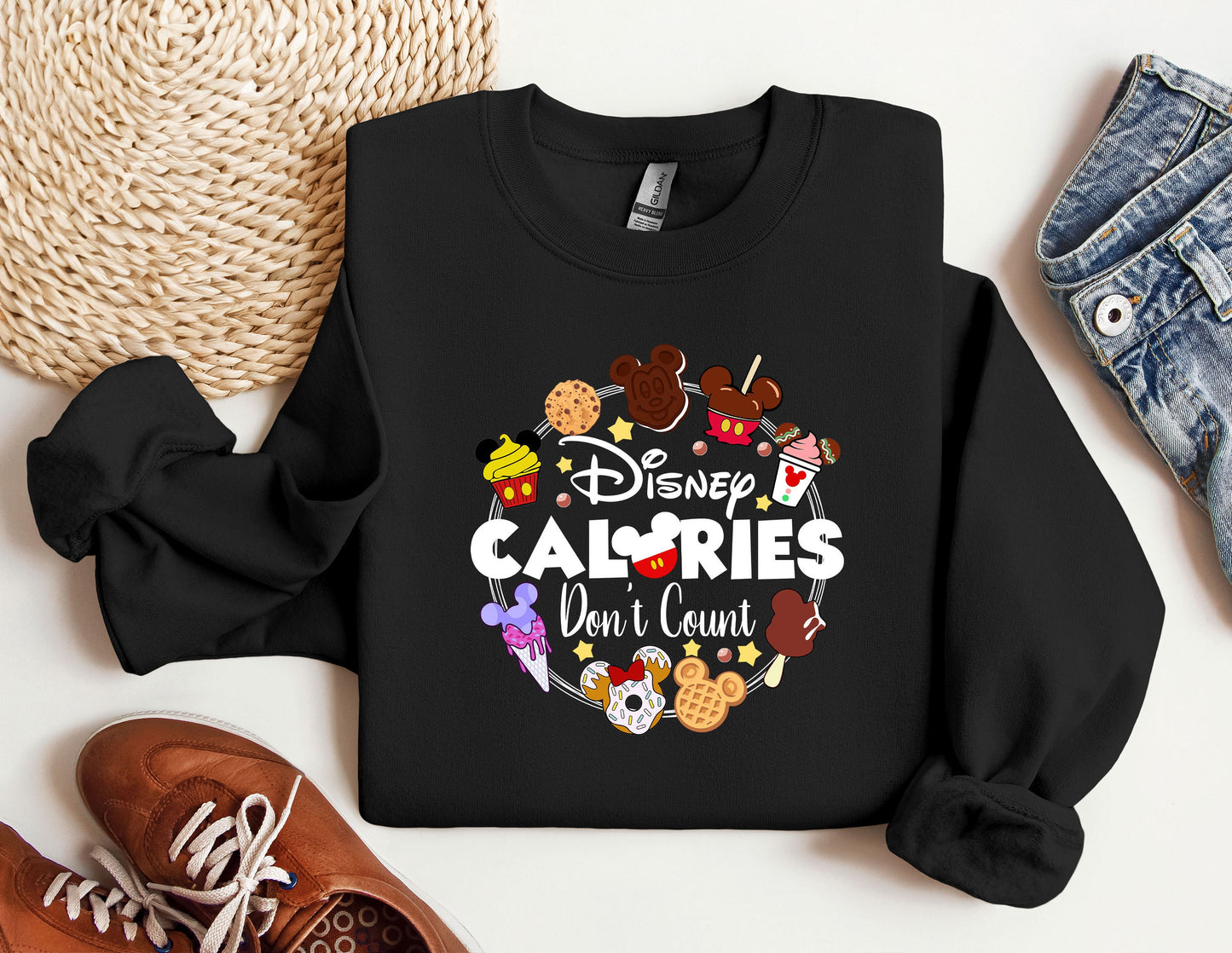 a black sweatshirt with the words disney calories don't count on it