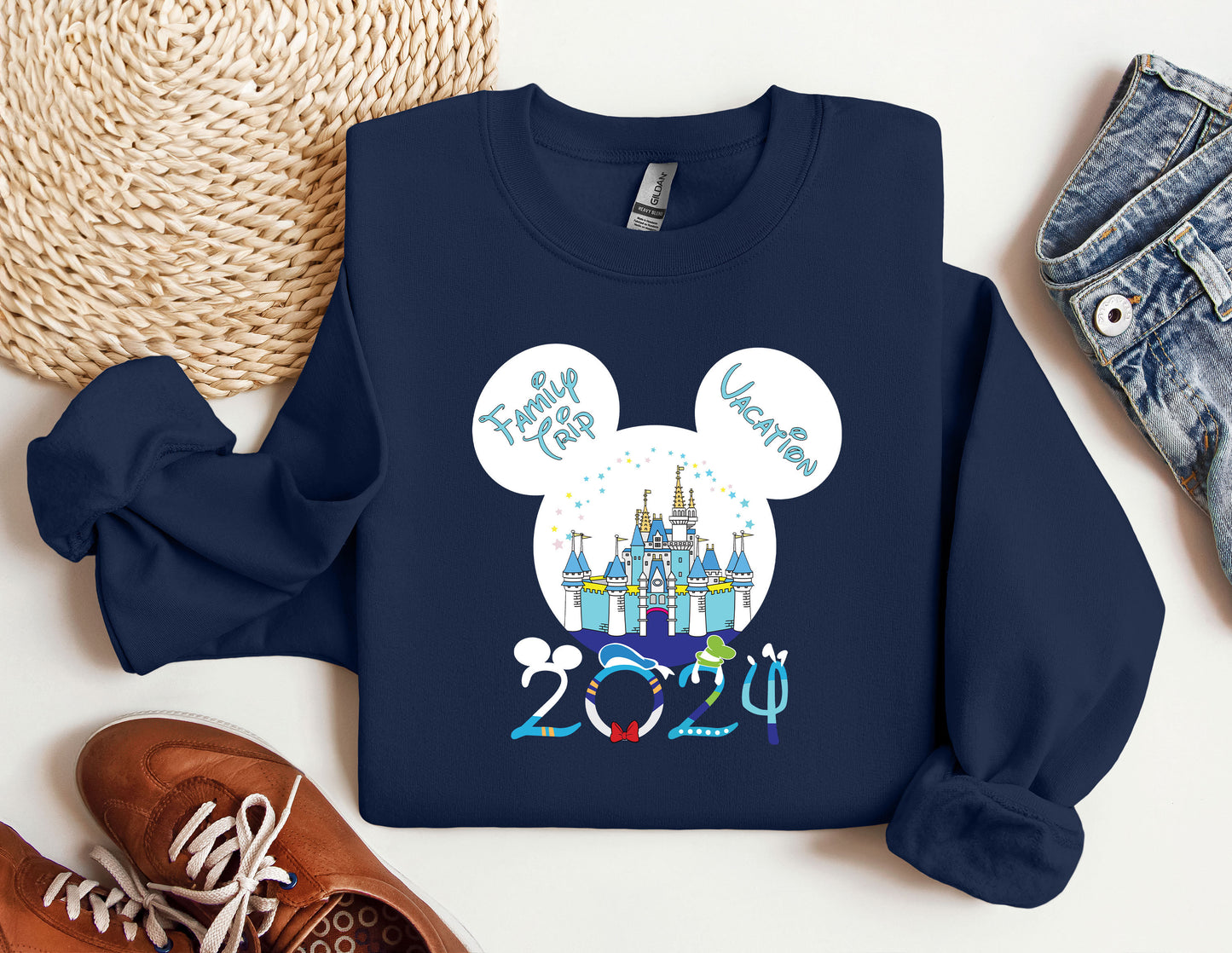 a blue shirt with a mickey mouse head on it