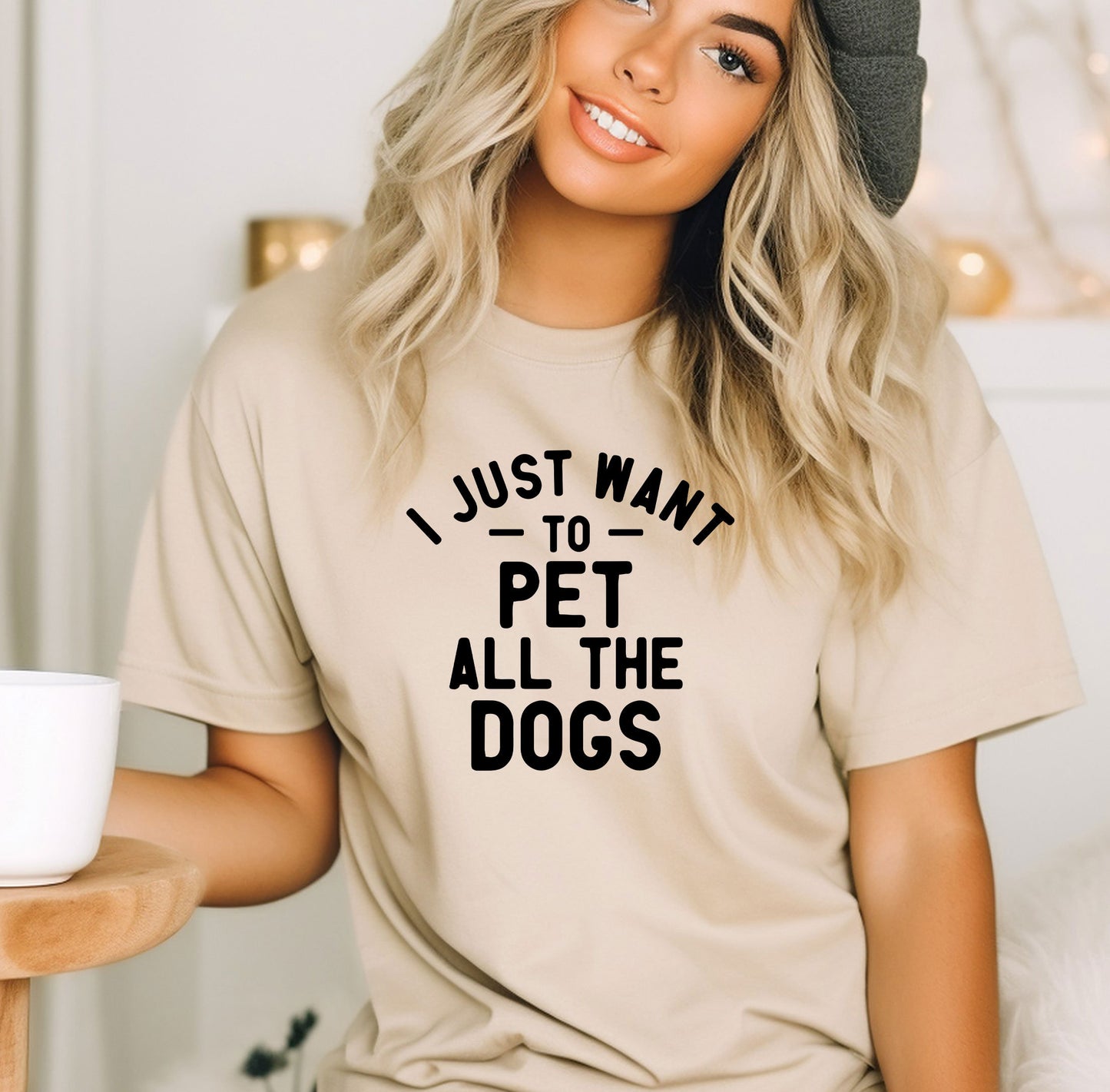 a woman wearing a t - shirt that says i just want to pet all the