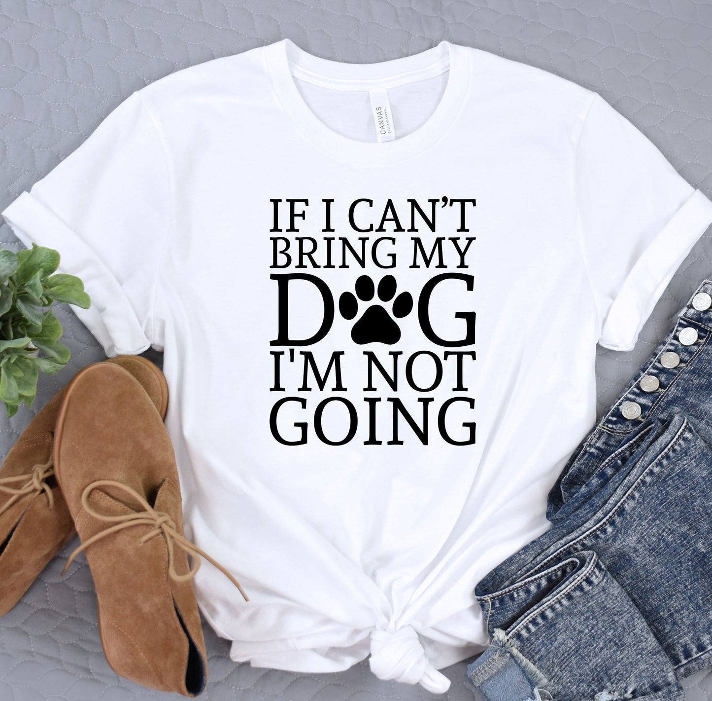 a white shirt with a dog's paw on it