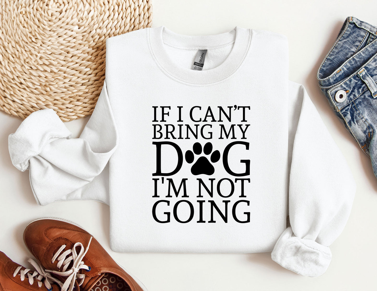 a white shirt with a dog's paw on it