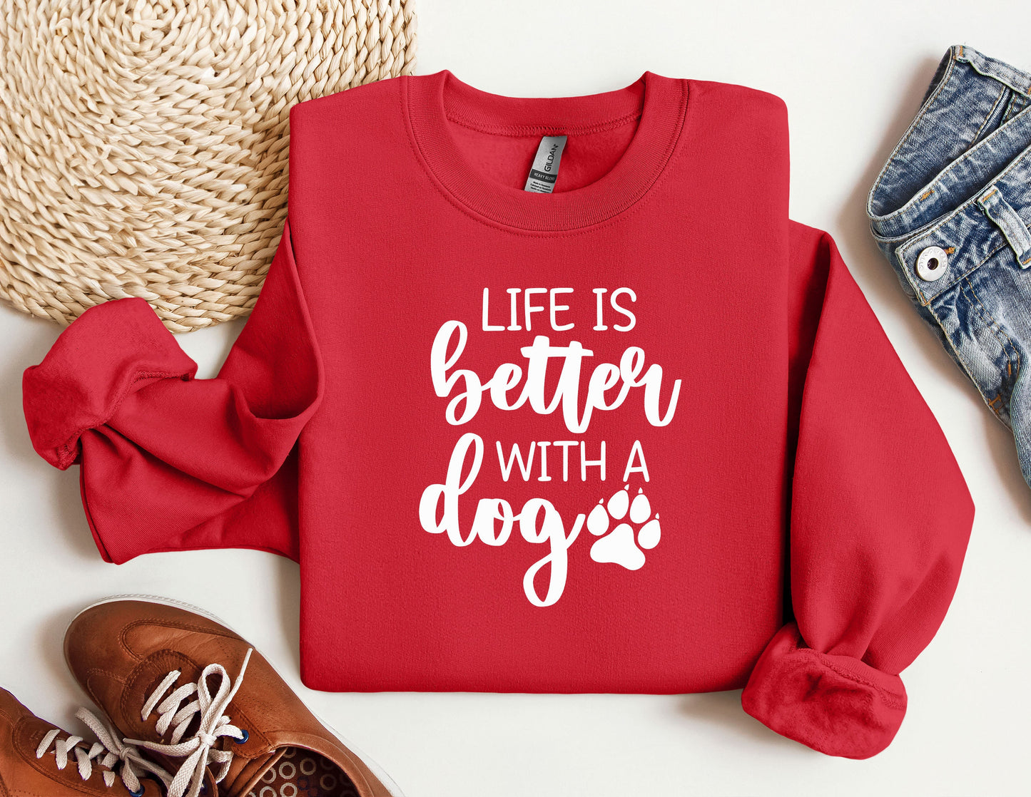 a red sweatshirt with a dog's paw on it