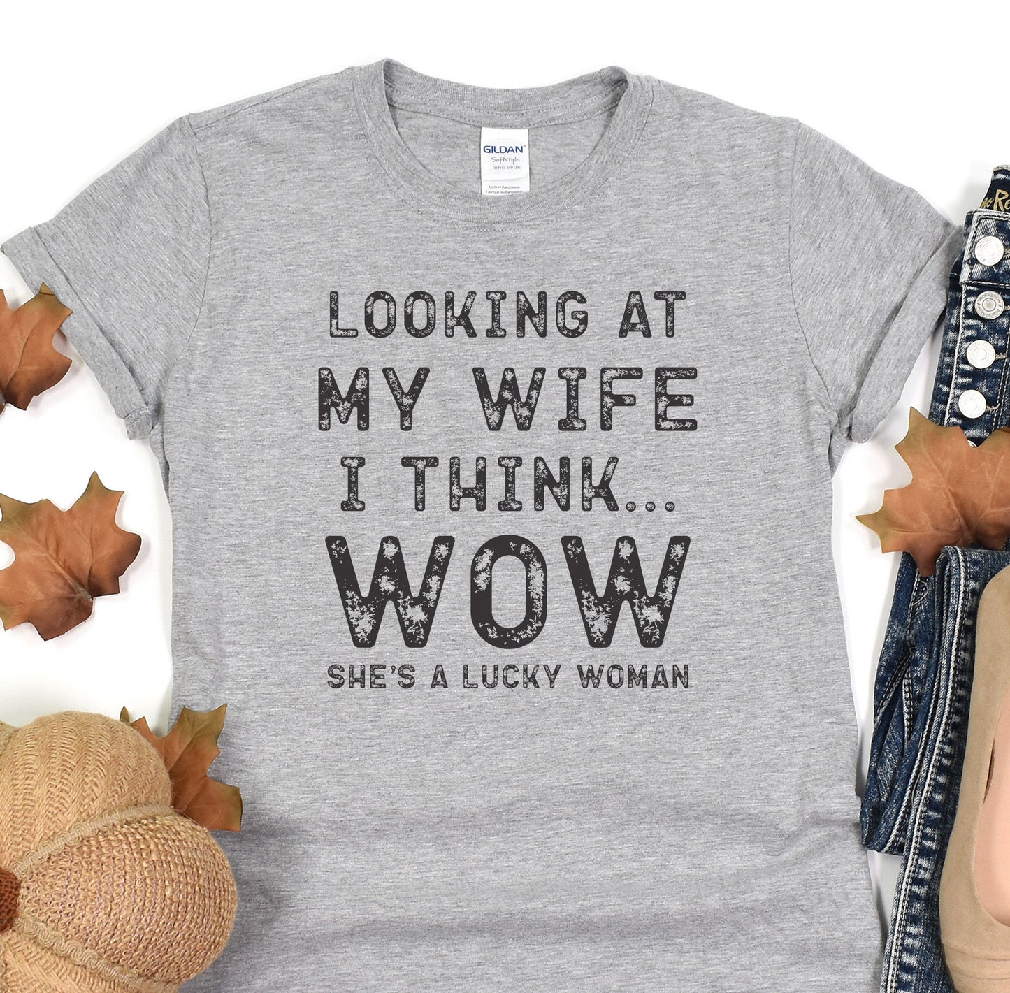a t - shirt that says looking at my wife i think wow she's