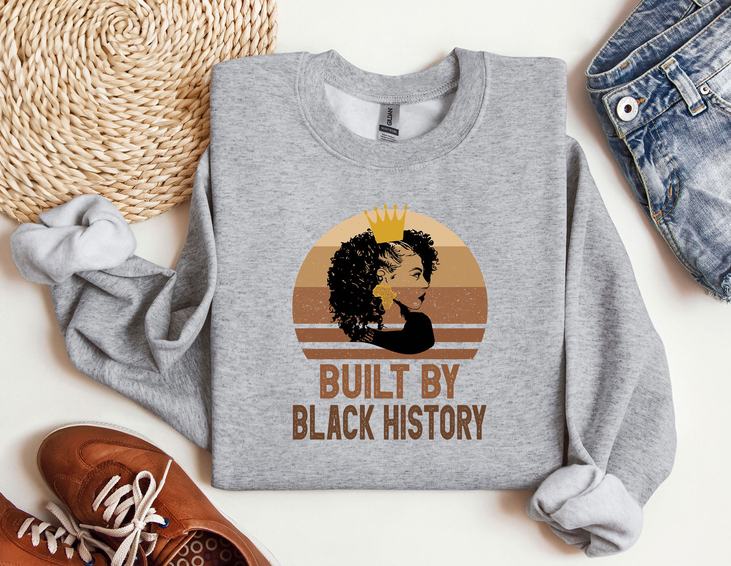 a sweatshirt with a picture of a woman's face and the words built by