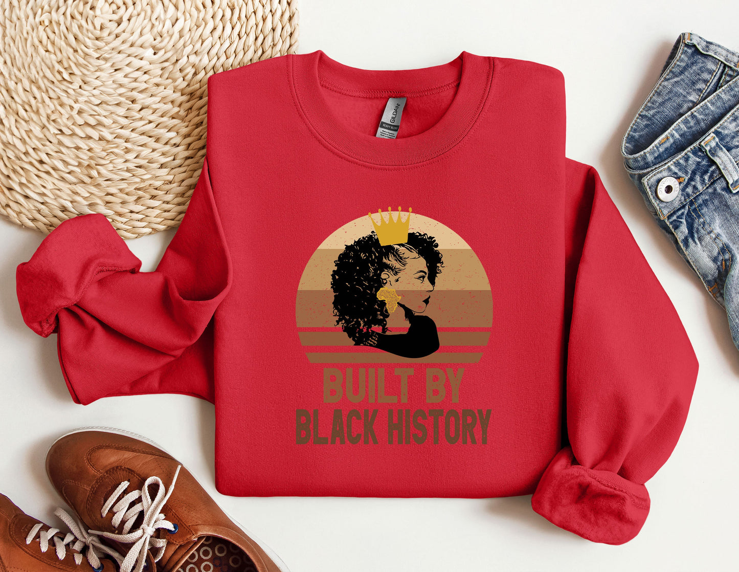 a red sweatshirt with a picture of a woman's face on it