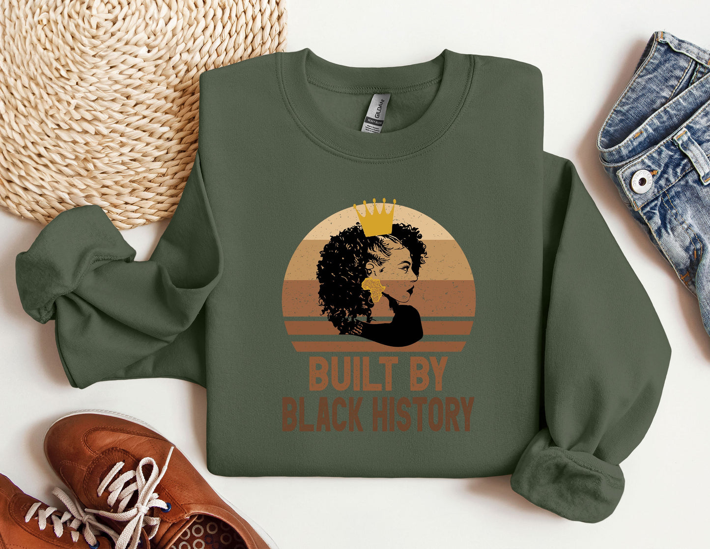 a green sweatshirt with a picture of a woman's face and the words built