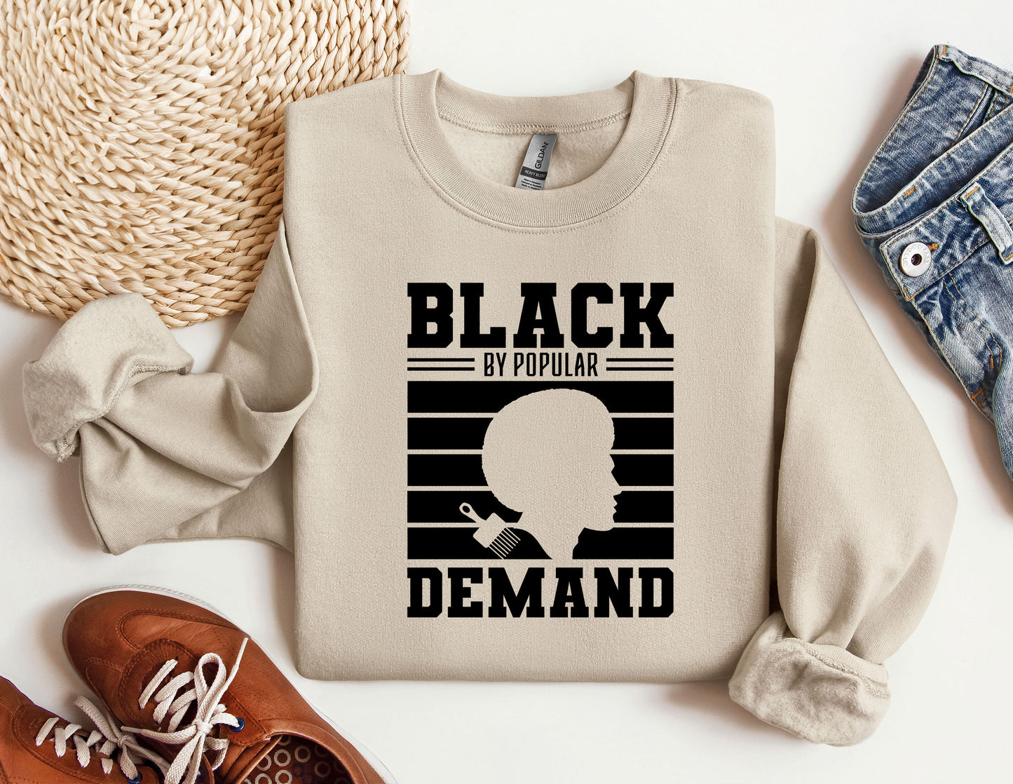 a sweater with a picture of a man's face and the words black is