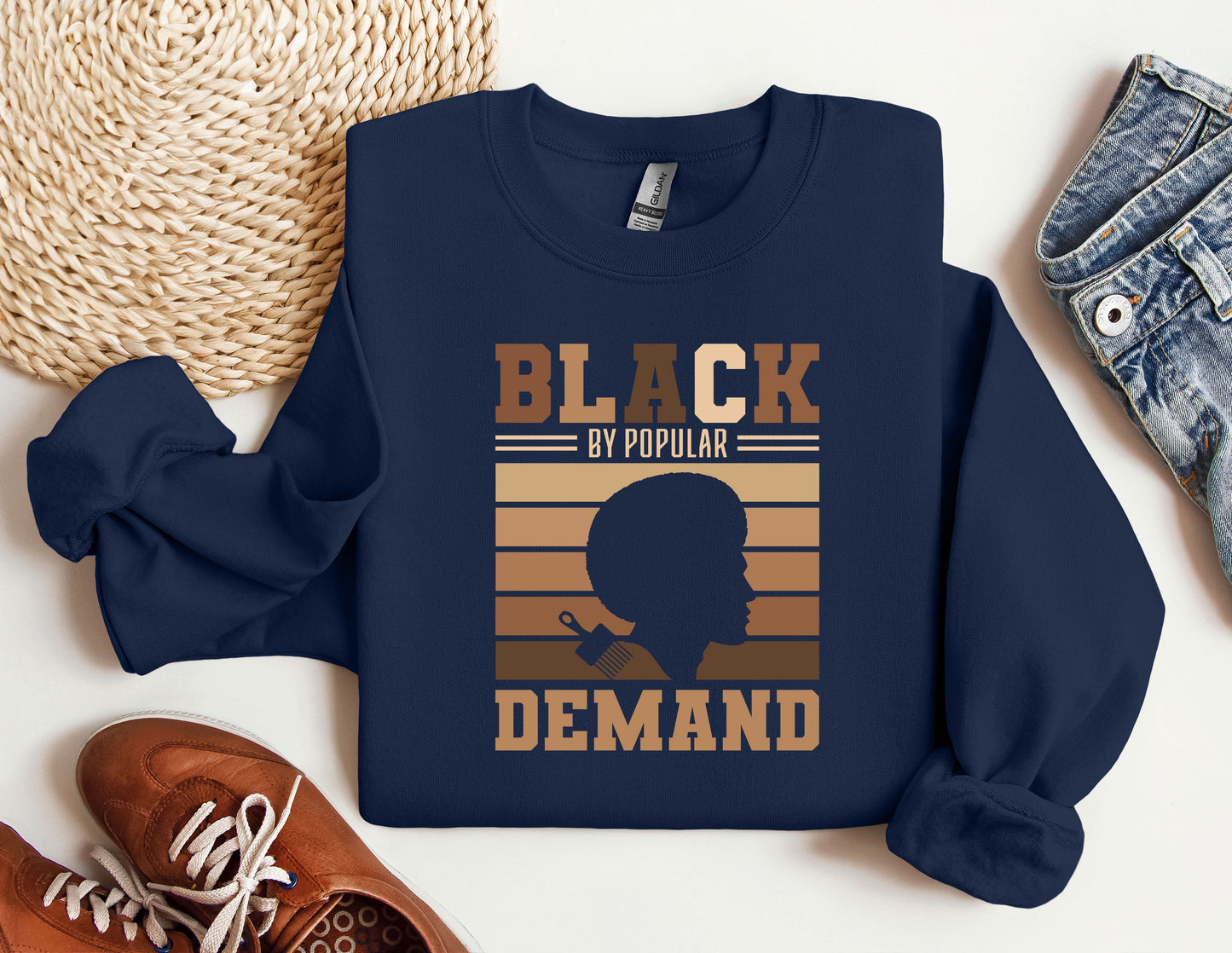 a blue sweatshirt with a picture of a man's head and the words black
