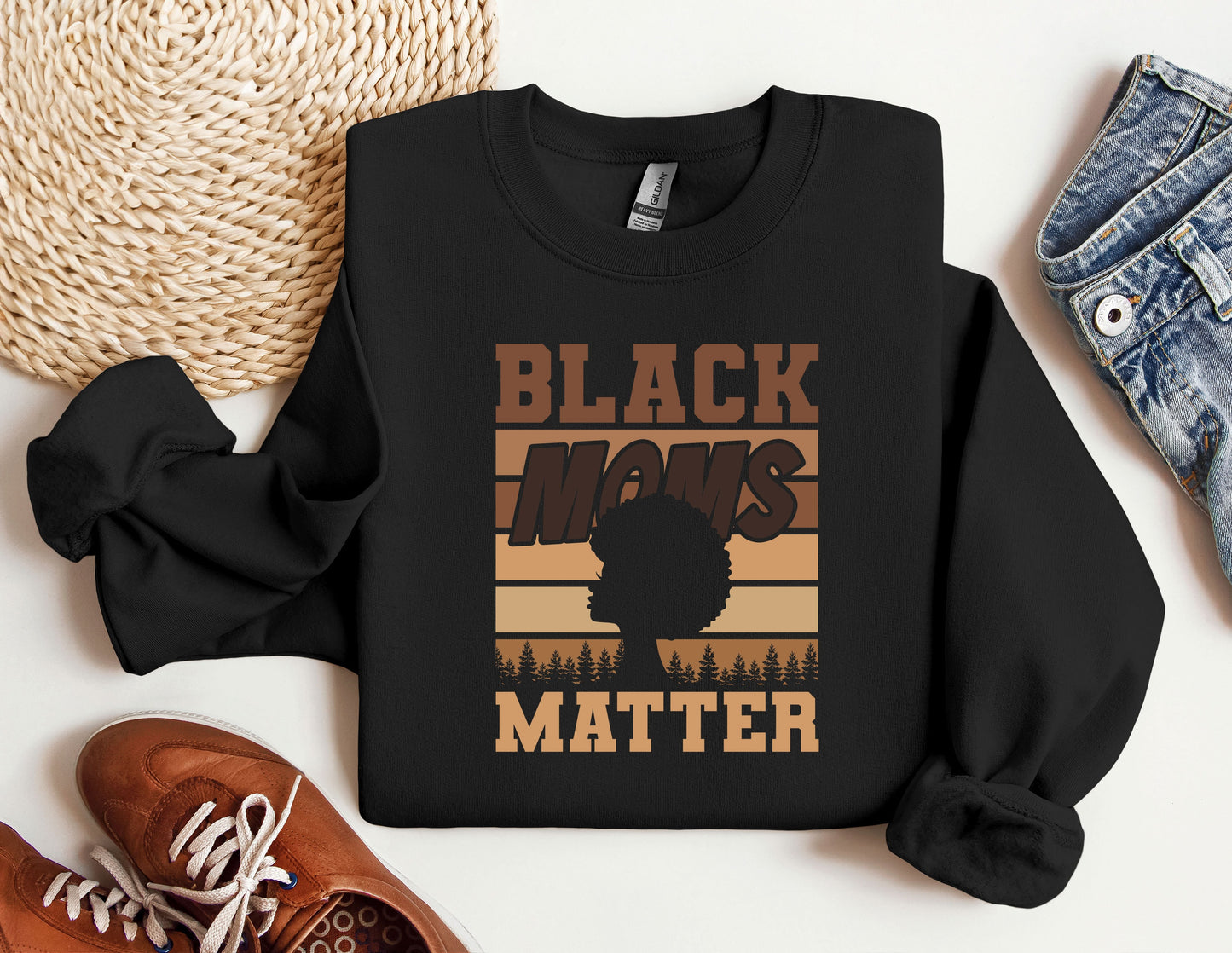 a black man's matter sweatshirt next to a pair of sneakers