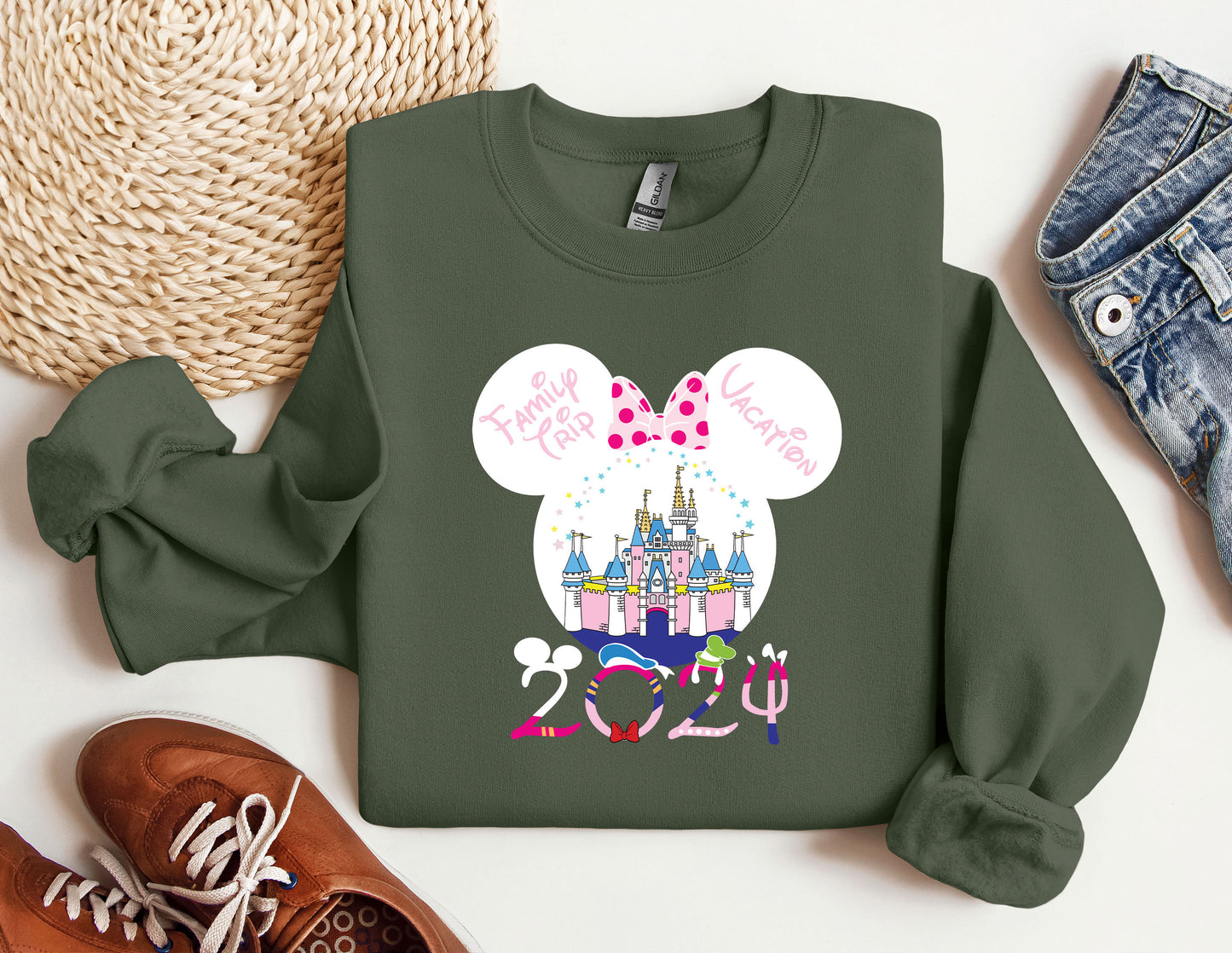 a green sweatshirt with a minnie mouse design on it