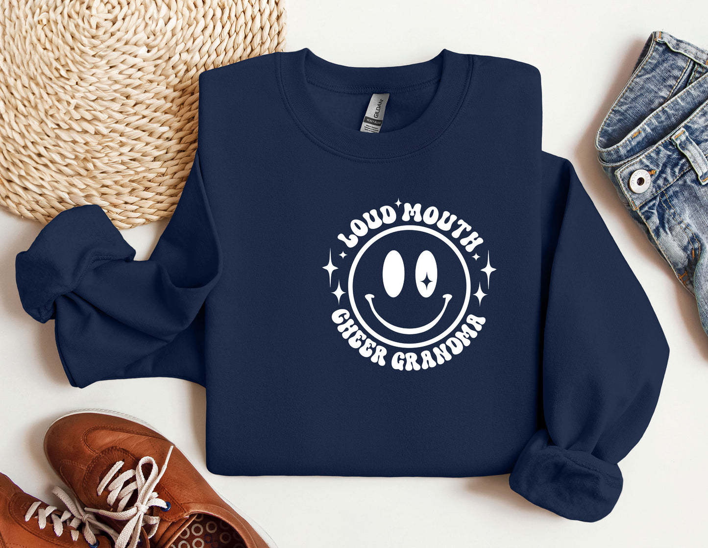 a blue sweatshirt with a smiley face on it