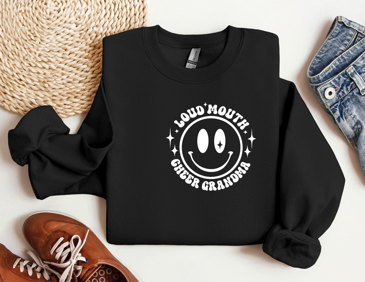 a black sweatshirt with a smiley face on it