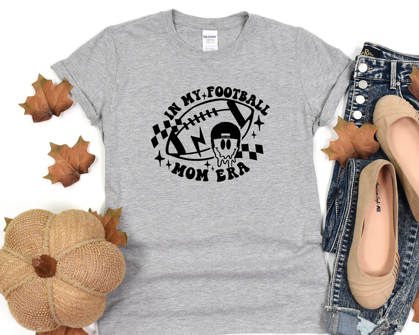 a women's t - shirt with a football design