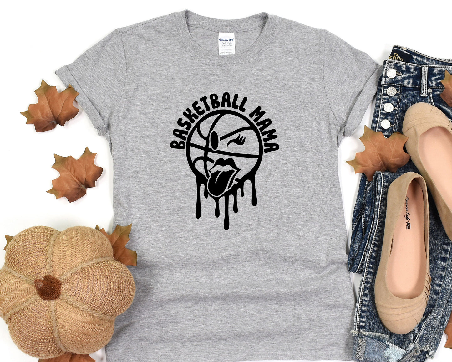 a women's t - shirt with a basketball logo on it