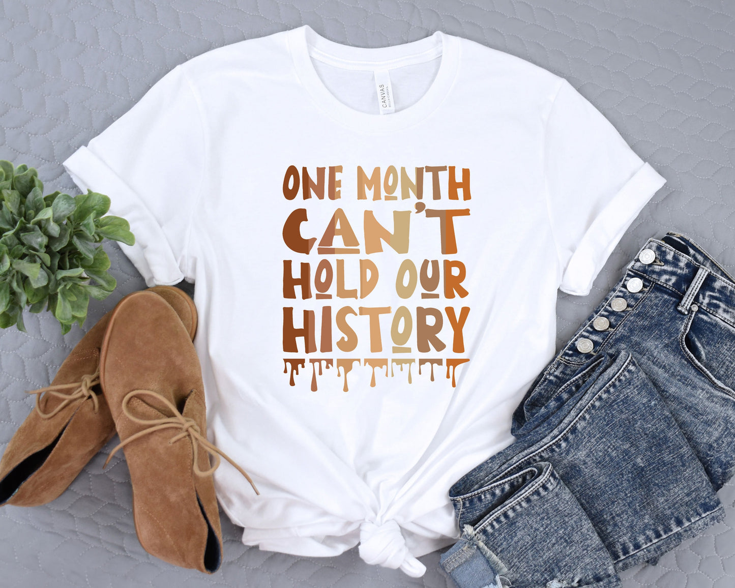 a t - shirt that says, one month can't hold our history