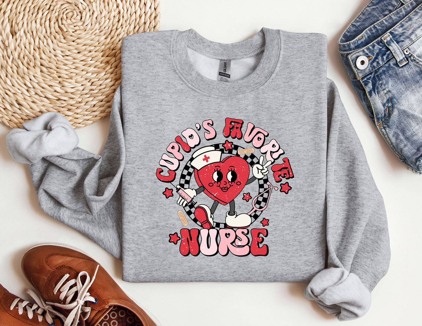 a grey sweatshirt with a heart on it