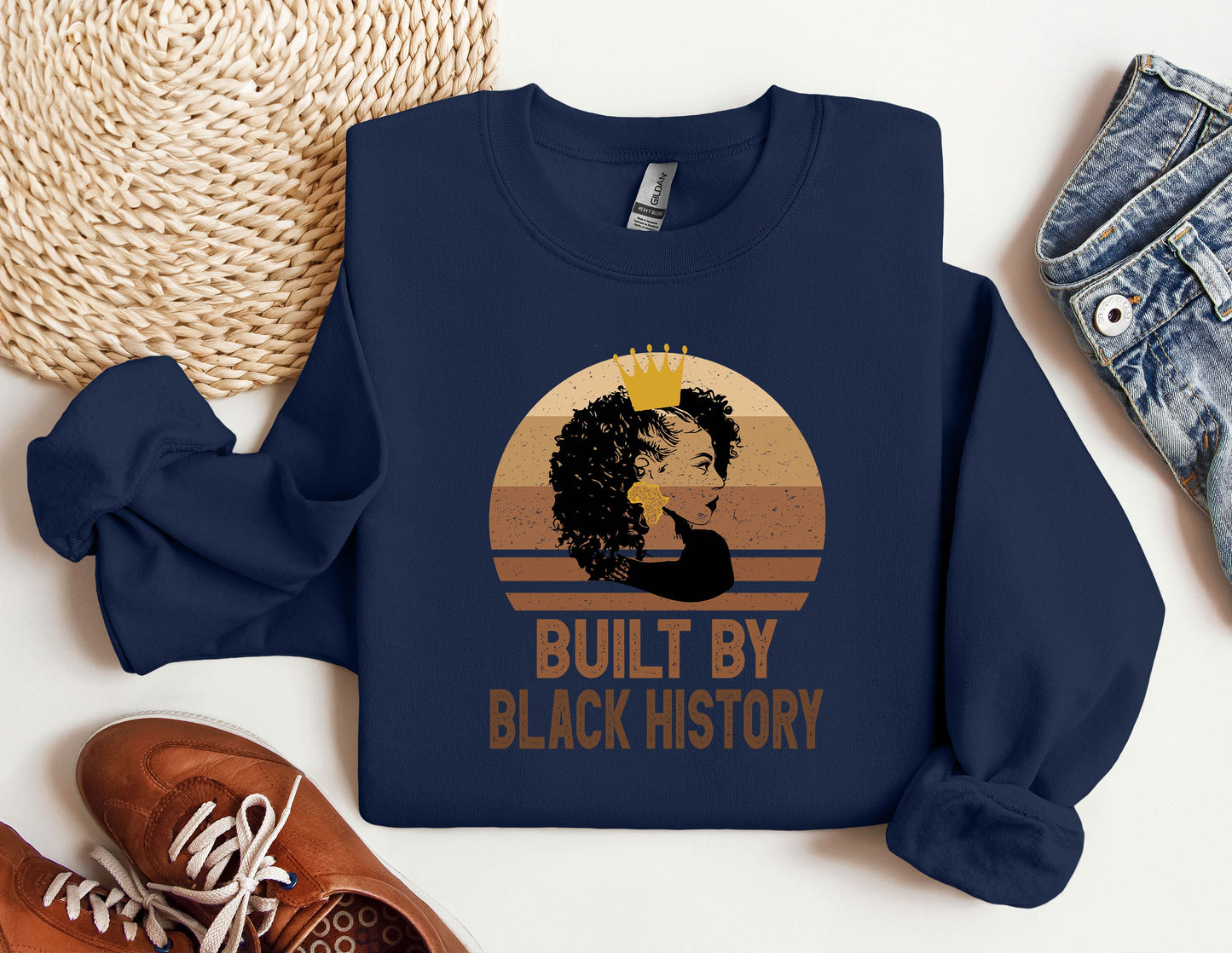 a blue sweatshirt with a picture of a woman's face and the words built
