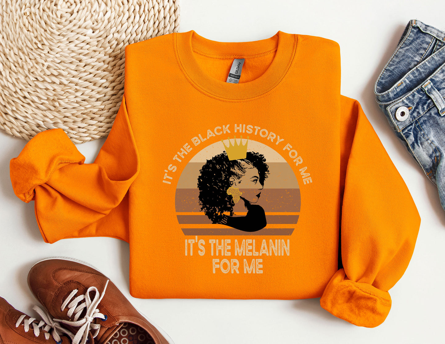 an orange shirt with a picture of a woman's face on it