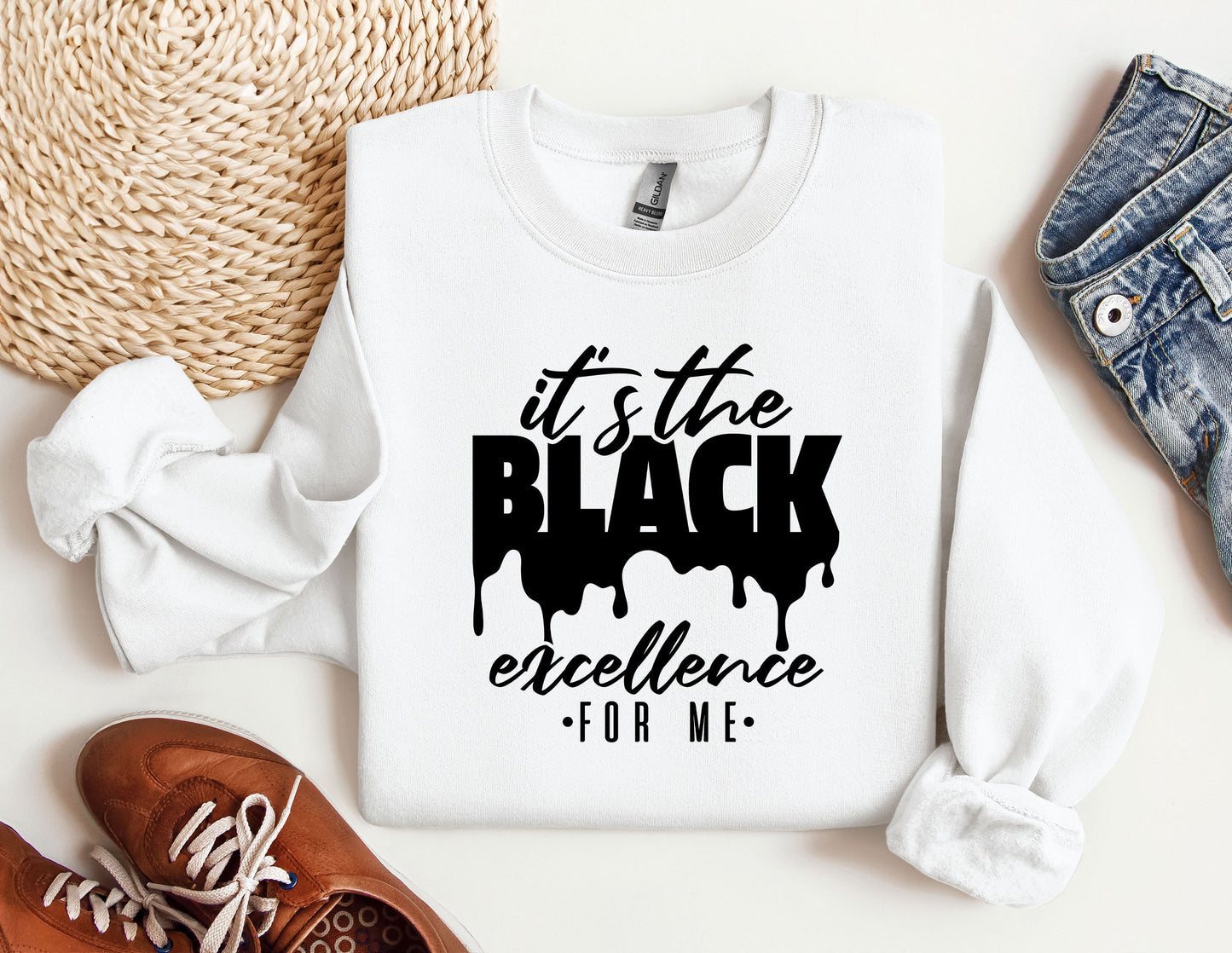 a white sweatshirt with the words it's the black excellence on it