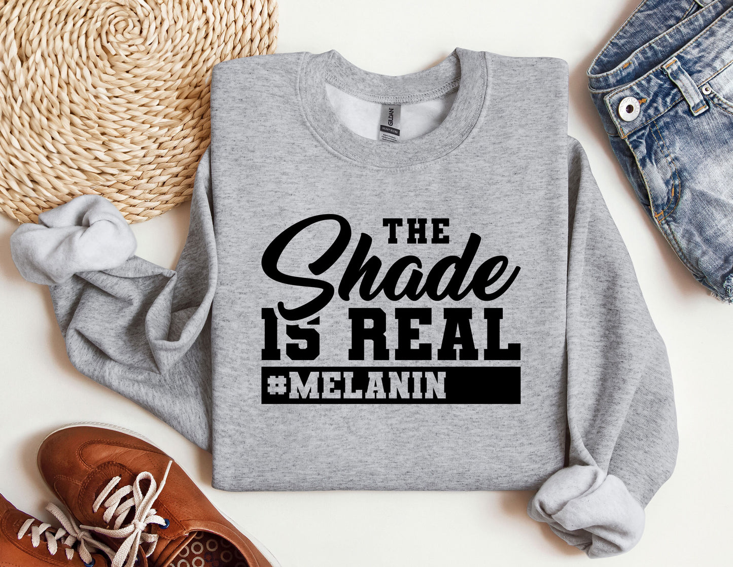 a sweatshirt that says the shade is real and melanin