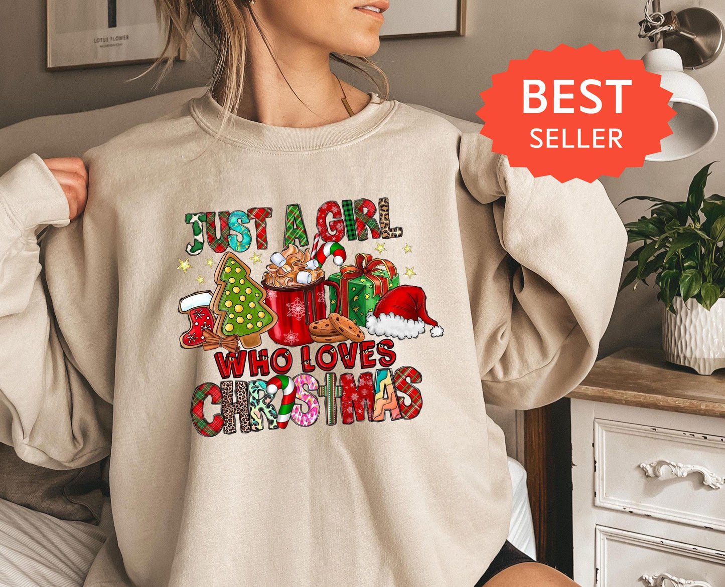 a woman wearing a sweatshirt that says, but a girl who loves christmas