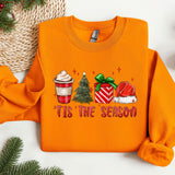 an orange sweater with a cup of coffee on it