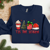 a christmas sweater with a cup of coffee and a christmas tree