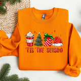 an orange sweater with a cup of coffee and a christmas tree on it