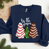 a blue sweater with christmas sweaters on it