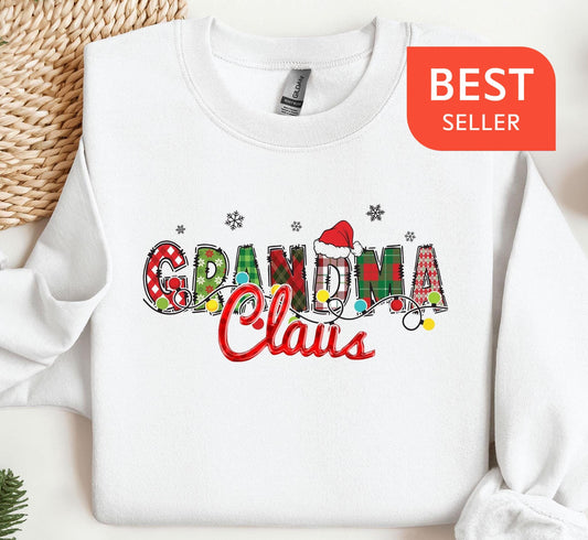 a white sweatshirt with the words grandma claus printed on it