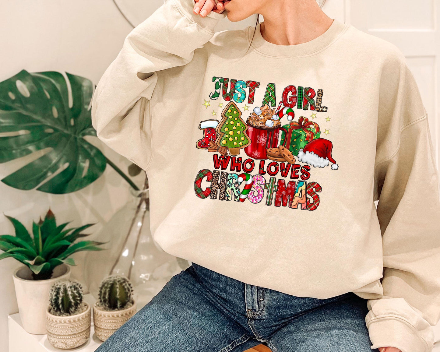 a woman sitting on a chair wearing a sweatshirt that says just a girl who loves