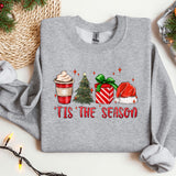 a gray sweater with a christmas tree and presents on it