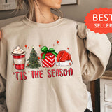 a woman wearing a sweatshirt with a christmas sweater on