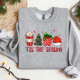 a christmas sweater with a cup of coffee and a christmas tree