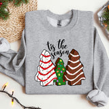 a sweater with a christmas tree and three trees on it