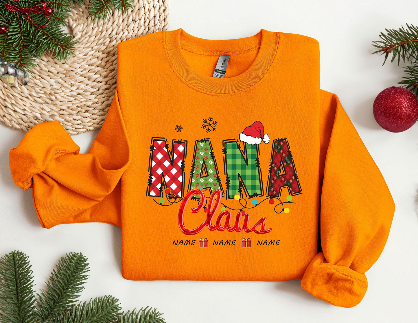 an orange shirt with the words mama claus on it