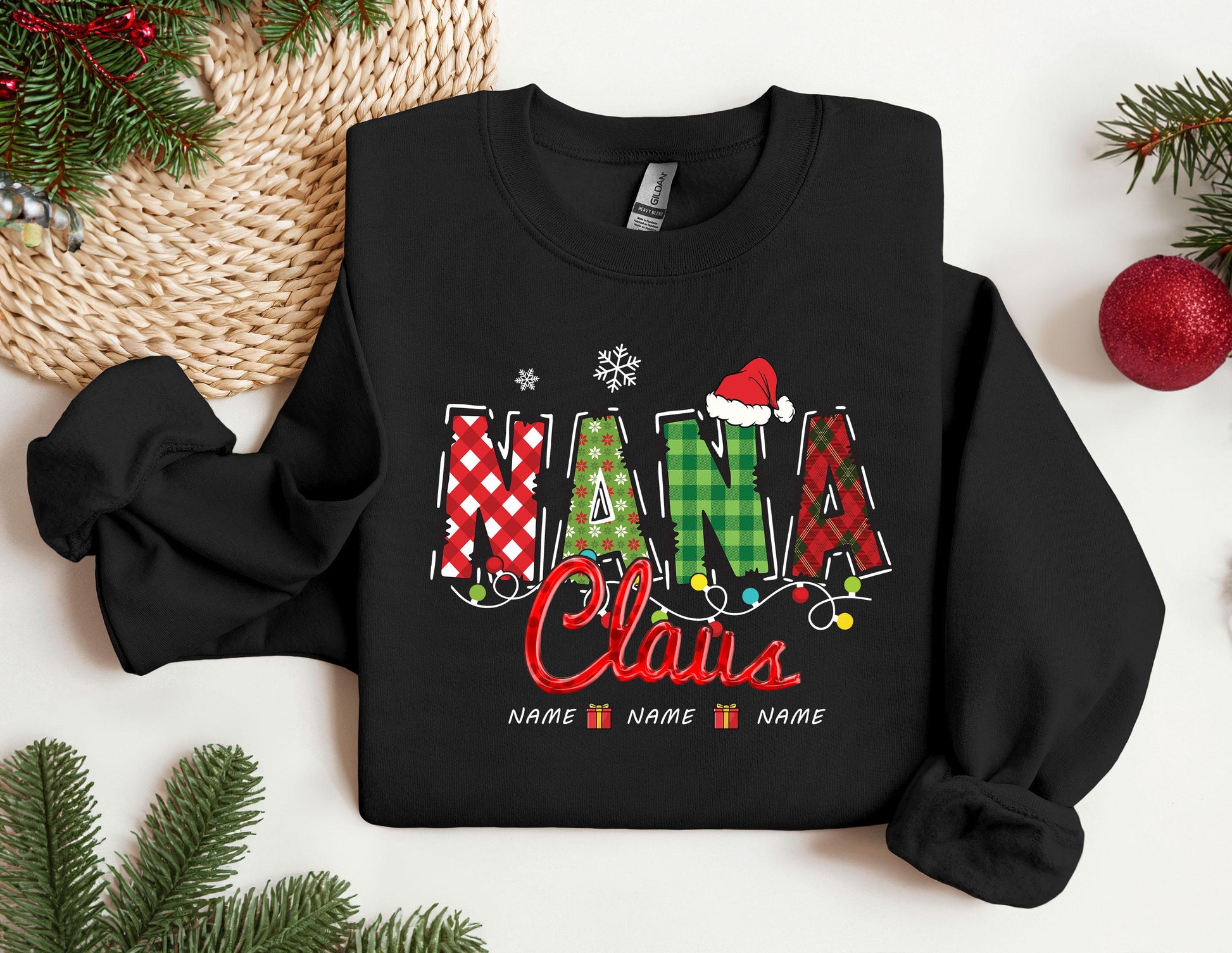 a black shirt with the word mama claus on it