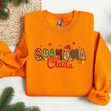an orange sweatshirt with the word grandma claus on it