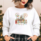 a woman standing in front of a christmas tree